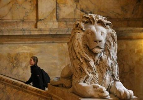One of two lions on guard at the Boston Public Library in Copley Square. The lions are made from unpolished Siena marble by sculptor Louis Saint-Gaudens. They are memorials to the Second and Twentieth Massachusetts Civil War infantry regiments.
