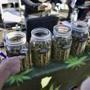 A vendor pointed to a selection of cannabis strains for sale during Kushstock 6.5 festival in Adelanto, Calif.