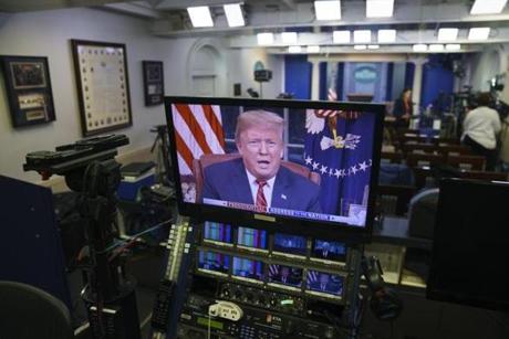 President Trump on monitors in the White House.

