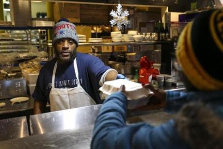Calvin Adams served a customer on Friday at Haley House Bakery Café in Roxbury. Saturday will be the last day.
