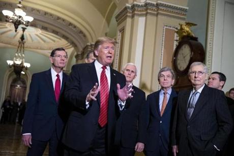 President Donald Trump, center, speaks to members of the media following a Senate Republicans policy luncheon at the U.S. Capitol in Washington, D.C. on Wednesday, Jan. 9. MUST CREDIT: Bloomberg photo by Al Drago.
