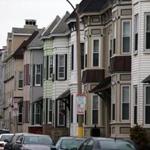 A block of multifamily homes in South Boston. City councilors have proposed levying fees on high-end real estate deals to help pay for more housing.