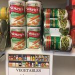 This March 14, 2018 photo shows canned goods at the campus food pantry of Schenectady County Community College in Schenectady, N.Y. New York is making free food pantries a standard fixture on all its public college campuses. It's part of efforts across the nation to deal with the ripple effect of rising college costs and changing student demographics that make it hard for some students to afford basics such as food. (AP Photo/Mary Esch)