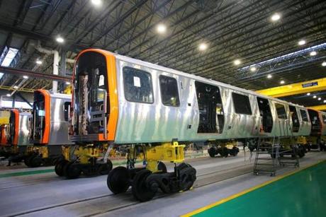 New Orange Line cars on the production floor of the factory in Springfield last month. 
