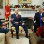 Vice President Mike Pence, center, looks on as House Minority Leader Rep. Nancy Pelosi, D-Calif., and President Donald Trump speak during a meeting in the Oval Office of the White House, Tuesday, Dec. 11, 2018, in Washington. (AP Photo/Evan Vucci)