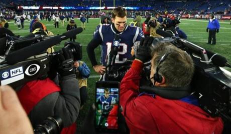 FOXBOROUGH, MASSACHUSETTS - JANUARY 13: Tom Brady #12 of the New England Patriots is interviewed after the AFC Divisional Playoff Game against the Los Angeles Chargers at Gillette Stadium on January 13, 2019 in Foxborough, Massachusetts. (Photo by Maddie Meyer/Getty Images)
