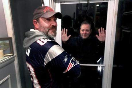 Natick, MA - 1/17/2019 - New England Patriot fans Keith Kingdon, at left, and brother Ken for feature on Patriot fans who are considered jinxed or bad luck. Keith won't allow Ken into his home on game days during the Patriots playoffs because he feels he may jinx the game. - (Barry Chin/Globe Staff), Section: Metro, Reporter: Beth Teitell Mandl, Topic: 19patsjinx, LOID: 8.5.148316317.
