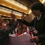 Congresswoman Ayanna Pressley gave high-fives to children on Friday after speaking at a Temple Israel gathering dedicated to the vision of the Rev. Martin Luther King Jr.