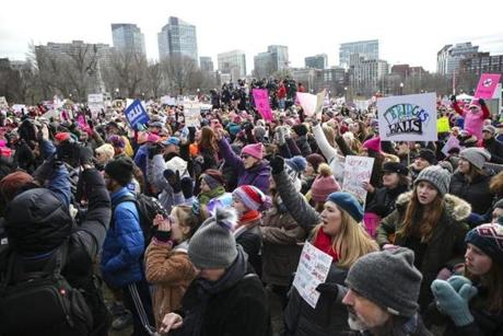 A crowd gathers in front of a stage to listen to speakers during the Boston Women's March on Boston Common Saturday afternoon.
