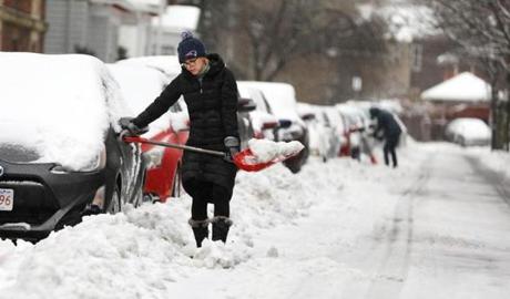 Residents on Lakeville Road in Jamaica Plain worked to clear out their vehicles on Sunday.
