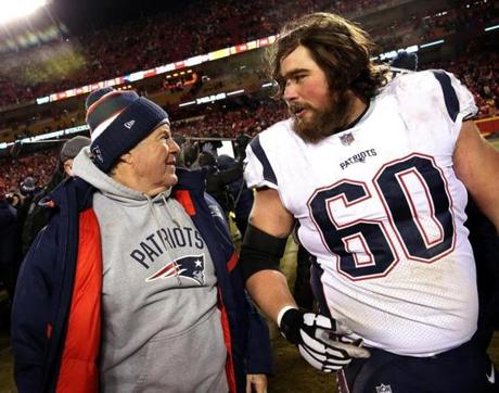 Kansas City, MO - 1/20/2019 - (overtime) New England Patriots head coach Bill Belichick and New England Patriots center David Andrews (60) celebrate the win. The Kansas City Chiefs host the New England Patriots in the AFC Championship game at Arrowhead stadium. - (Barry Chin/Globe Staff), Section: Sports, Reporter: James M. McBride, Topic: 21Patriots-Chiefs, LOID: 8.5.157043654.
