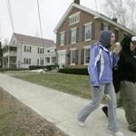 *RETRANSMISSION TO CHANGE SLUG TO FEWER-VERMONTERS. NO OTHER CHANGES -- (NYT51) POULTNEY, Vt. -- March 3, 2006 -- FEWER-VERMONTERS -- Students from Green Mountain College pass the college's Dean's home along Main Street across from the campus, Feb. 9, 2006. Vermont schools like Green Mountain College draw many students from other states, but most Vermonters choose to attend college elsewhere. (Librado Romero/The New York Times)