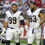 Los Angeles Rams defensive end Aaron Donald (99) and Ndamukong Suh (93) during the first half of an NFL football game against the Arizona Cardinals, Sunday, Dec. 23, 2018, in Glendale, Ariz. (AP Photo/Rick Scuteri)