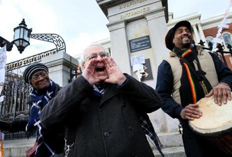 Community activist Lew Finfer addressed a crowd of more than 100 who gathered on Friday at the State House to commemorate the protest 50 years ago that halted the Inner Belt highway project. 
