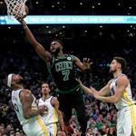 Boston, MA - 1/26/2019 - (2nd quarter) Boston Celtics guard Jaylen Brown (7) splits the Warrior defense as he drives to the basket during the second quarter. The Boston Celtics host the Golden State Warriors at TD Garden. - (Barry Chin/Globe Staff), Section: Sports, Reporter: Adam Himmelsbach, Topic: 27Warriors-Celtics, LOID: 8.5.195486713.