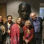 From left to right: Jaclyn, Maya, Erica, Julia, Roy, and Zachary Wilson posed for a portrait in front of the bronze sculpture of Martin Luther King Jr. after an unveiling ceremony at Brookline Town Hall Sunday evening.
