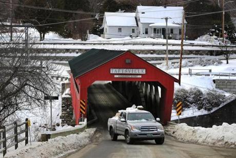 Woodstock, VT. 01/16/19- A large pickup truck exits the Taftsville Covered Bridge in Woodstock. Carbon emissions have risen 16 percent above the 1990 levels in Vermont, some of the reasons are aging gas-guzzling pickups, wood-buriing stoves and drafty old homes. Photo by John Tlumacki/Globe Staff(metro)
