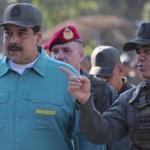 The sanctions are the latest attempt to force Nicolas Maduro (left) out as Venezuela?s president.