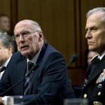 Director of National Intelligence Daniel Coats (center) testified before the Senate Intelligence Committee Tuesday. 