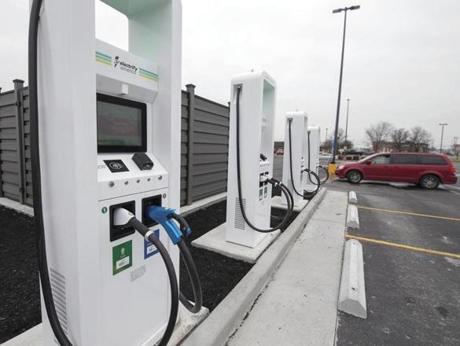 Electrify America, an electric car charger producer, has opened a charging station Wednesday, Jan. 16, 2019, in Paducah, Ky. The charging station is located at the side of the parking lot at the Walmart store on Hinkleville Road. (Ellen O'Nan/The Paducah Sun via AP)
