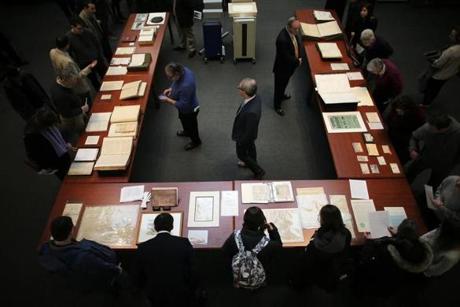 Boston, MA - 01/29/19 - Guests visit with archival items during the opening celebration. New vault storage opened at the Massachusetts State Archives, allowing state, court, and military records to reside in one place. (Lane Turner/Globe Staff) Reporter: (in caps) Topic: (30newvault)
