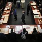 Boston, MA - 01/29/19 - Guests visit with archival items during the opening celebration. New vault storage opened at the Massachusetts State Archives, allowing state, court, and military records to reside in one place. (Lane Turner/Globe Staff) Reporter: (in caps) Topic: (30newvault)