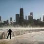 CHICAGO, ILLINOIS - JANUARY 30: A man takes a picture along the lakefront as temperatures hovered around -20 degrees on January 30, 2019 in Chicago, Illinois. Businesses and schools have closed, Amtrak has suspended service into the city, more than a thousand flights have been cancelled and mail delivery has been suspended as the city copes with record-setting low temperatures. (Photo by Scott Olson/Getty Images)