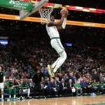 Boston, MA - 1/30/2019 - (2nd quarter) Boston Celtics guard Jaylen Brown (7) dunks over his shoulder off a fast break during the second quarter. The Boston Celtics host the Charlotte Hornets at TD Garden. - (Barry Chin/Globe Staff), Section: Sports, Reporter: Adam Himmelsbach, Topic: 31Celtics-Hornets, LOID: 8.5.264274694.