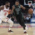 Boston Celtics guard Kyrie Irving (11) drives to the basket against New York Knicks guard Kadeem Allen (0) during the second half of an NBA basketball game Friday, Feb. 1, 2019, at Madison Square Garden in New York. The Celtics won 113-99. (AP Photo/Mary Altaffer)