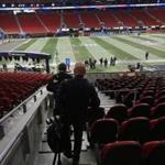 Atlanta, GA - 2/1/2018 - Boston Globe photojournalists Barry Chin and Jim Davis head down to the field to tape off positions at Mercedes Benz Stadium. Bill Greene/Globe Staff