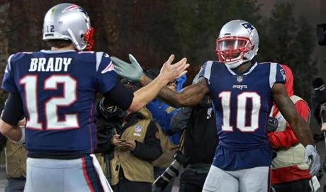 Tom Brady and Josh Gordon celebrate a touchdown pass in the Patriots? Dec. 2 game against the Vikings.
