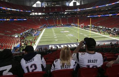 SUPER BOWL LIII SLIDER Atlanta, GA - 2-03-19 - Early arriving Patriot fans from Massachusetts in their seats before the New England Patriots play the Los Angeles Rams in Super Bowl LIII at Mercedes-Benz Stadium. (Bill Greene /Globe Staff)
