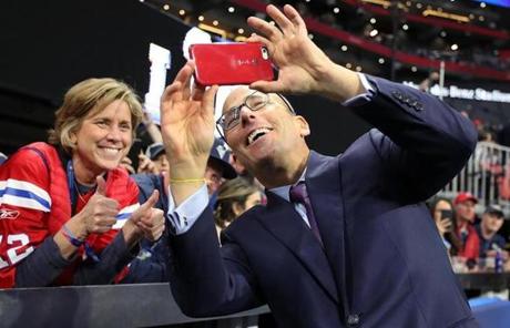 SUPER BOWL LIII SLIDER 02-03-19: Atlanta, GA: Patriots president Jonathan Kraft (right) takes a selfie with a fan before the game. The New England Patriots met the Los Angeles Rams in Super Bowl LIII at Mercedes-Benz Stadium. (Jim Davis /Globe Staff)
