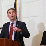 Virginia Governor Ralph Northam spoke during a press conference next to his wife, Pam, in Richmond on Saturday.
