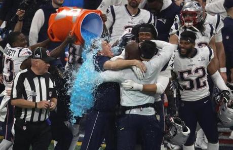SUPER BOWL LIII SLIDER Atlanta, GA - 2-03-19 - Bill Belichick and team get a bath after the game. The New England Patriots play the Los Angeles Rams in Super Bowl LIII at Mercedes-Benz Stadium. (Stan Grossfeld/Globe Staff)
