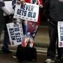 Fans carried ?Never Gets Old? signs at the Patriots parade Tuesday.