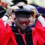 Boston, MA -- 5/21/2017 - Former Boston Red Sox player David Ortiz adjusted his cap during Boston University Commencement where he was awarded an honorary degree. (Jessica Rinaldi/Globe Staff) Topic: 22bu Reporter: 