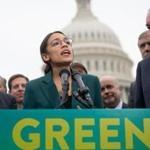 US Representative Alexandria Ocasio-Cortez, Democrat of New York, and US Senator Ed Markey (R), Democrat of Massachusetts, speak during a press conference to announce Green New Deal legislation to promote clean energy programs outside the US Capitol in Washington, DC, February 7, 2019. (Photo by SAUL LOEB / AFP)SAUL LOEB/AFP/Getty Images
