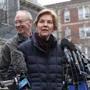 Cambridge, Ma., 12/31/2018, Senator Elizabeth Warren and her husband Bruce and dog Bailey greet the media outside her home after announcing she has launched an exploratory committee for President 2020. Suzanne Kreiter/Globe staff 
