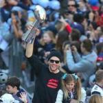 Tom Brady has the Lombardi Trophy in hand as he celebrated a sixth Super Bowl title at the parade for the Patriots.