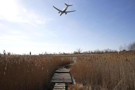Planes frequent the skies over Belle Isle Marsh in East Boston.
