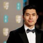 Actor Henry Golding poses on the red carpet at the BAFTA British Academy Film Awards at the Royal Albert Hall in London on Feb. 10, 2019. 