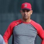 Fort Myers, FL 2/13/2018: Red Sox manager Alex Cora (right) is pictured as he watches thirdbasemen Rafael Devers (front) and Tzu-Wei Lin (rear) take ground balls during a workout at the Player Development Complex at Jet Blue Park. (Jim Davis/Globe Staff)