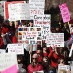 Teachers and supporters held up placards during a rally in Denver this week. 