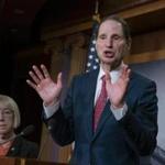 FILE - In this Dec. 19, 2018, file photo, Sen. Ron Wyden, D-Ore., joined at left by Sen. Patty Murray, D-Ore., speaks during a news conference to press Congress to intervene on behalf of the Affordable Care Act, after a federal judge in Texas ruled it unconstitutional, on Capitol Hill in Washington. Wyden has proposed legislation that would give states a free hand to allow legal marijuana markets without the threat of federal criminal intervention. (AP Photo/J. Scott Applewhite, File)