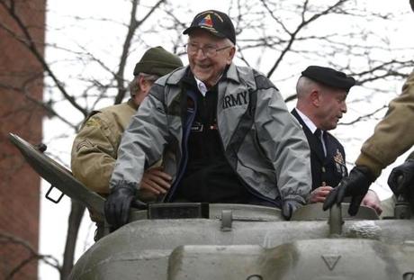 Charlestown, MA -- 95-year-old WWII veteran Clarence Smoyer was all smiles Wednesday as he boarded a Sherman Tank before riding it to the Charlestown Navy Yard. (Jessica Rinaldi/Globe Staff) 
