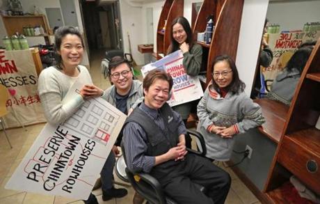 BOSTON, MA - 2/20/2019:ALL SMILES.....surrounded by Chinese Progressive Association staff members , Chinatown hair salon owner, Yan Chi Chen seated center who has run a hair salon at 106 Tyler St in Boston's Chinatown, settles with his landlord out of court and to his advantage, he won't be displaced. (David L Ryan/Globe Staff ) SECTION: METRO TOPIC 21chinatownphoto
