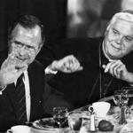President George H. W. Bush and Cardinal Bernard F. Law sit at a table during a luncheon for the Catholic Lawyers Guild at the Park Plaza Hotel in Boston on Sept. 23, 1989.  