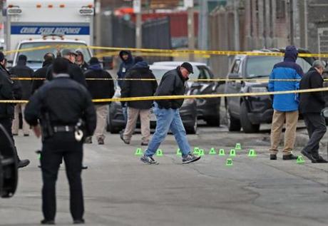 BOSTON, MA - 2/22/2019:Green markers for evidence ( shell cashings ). Boston Police shooting on Gerard st in the early am after police pulling over a driver on a traffic stop. Suspect shoot at police officers hitting one without serious inury. Suspect was shoot and found dead on George Street in his vehicle. (David L Ryan/Globe Staff ) SECTION: METRO TOPIC 
