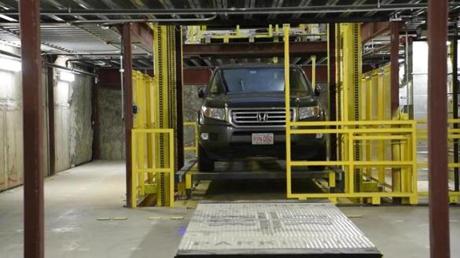 A car is lowered in the Automated Guided Vehicle Parking Vault in the building constructed by Commodore Builders -- The Boulevard at 110 Broad Street, Boston. 22Parking BUSINESS 2-22-19
